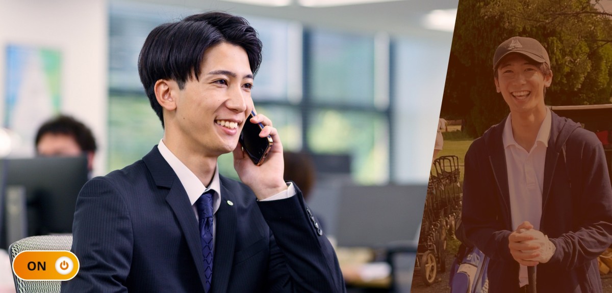 勤務中の石井さん。笑顔で電話をしている。オフィスの自席で正面を向いて座り、左手にスマホをもっているシーン。背筋が伸び濃紺のスーツに光沢のある上品な青のネクタイで仕事モードを感じる写真。ON/OFFで言うところの「ON」状態