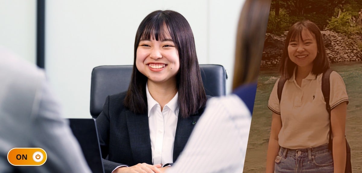 勤務中の生井さん。対面に座る2人のお客様と商談中。明るい笑顔をお客様の背中越しから撮影した写真。ON/OFFで言うところの「ON」状態